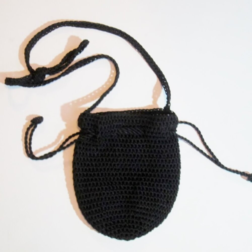 Black  woven clutch bag, made in Brazil.